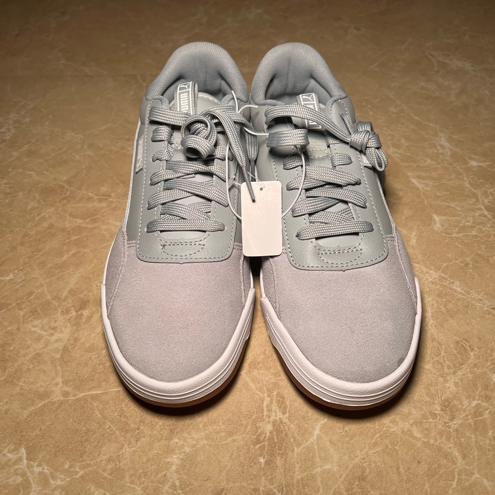Gray and white womans puma in size 8 wide fit
